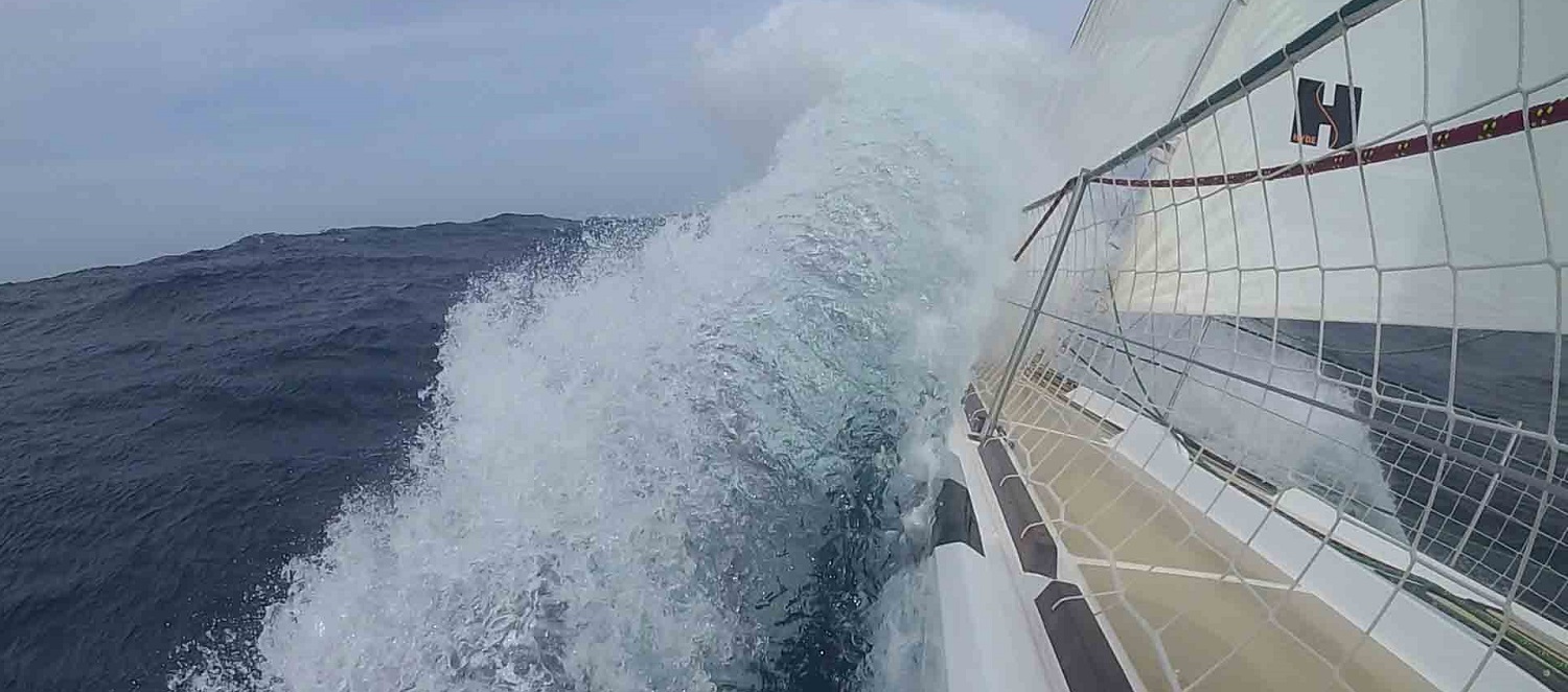 Wave crashing over the bow of Greenings