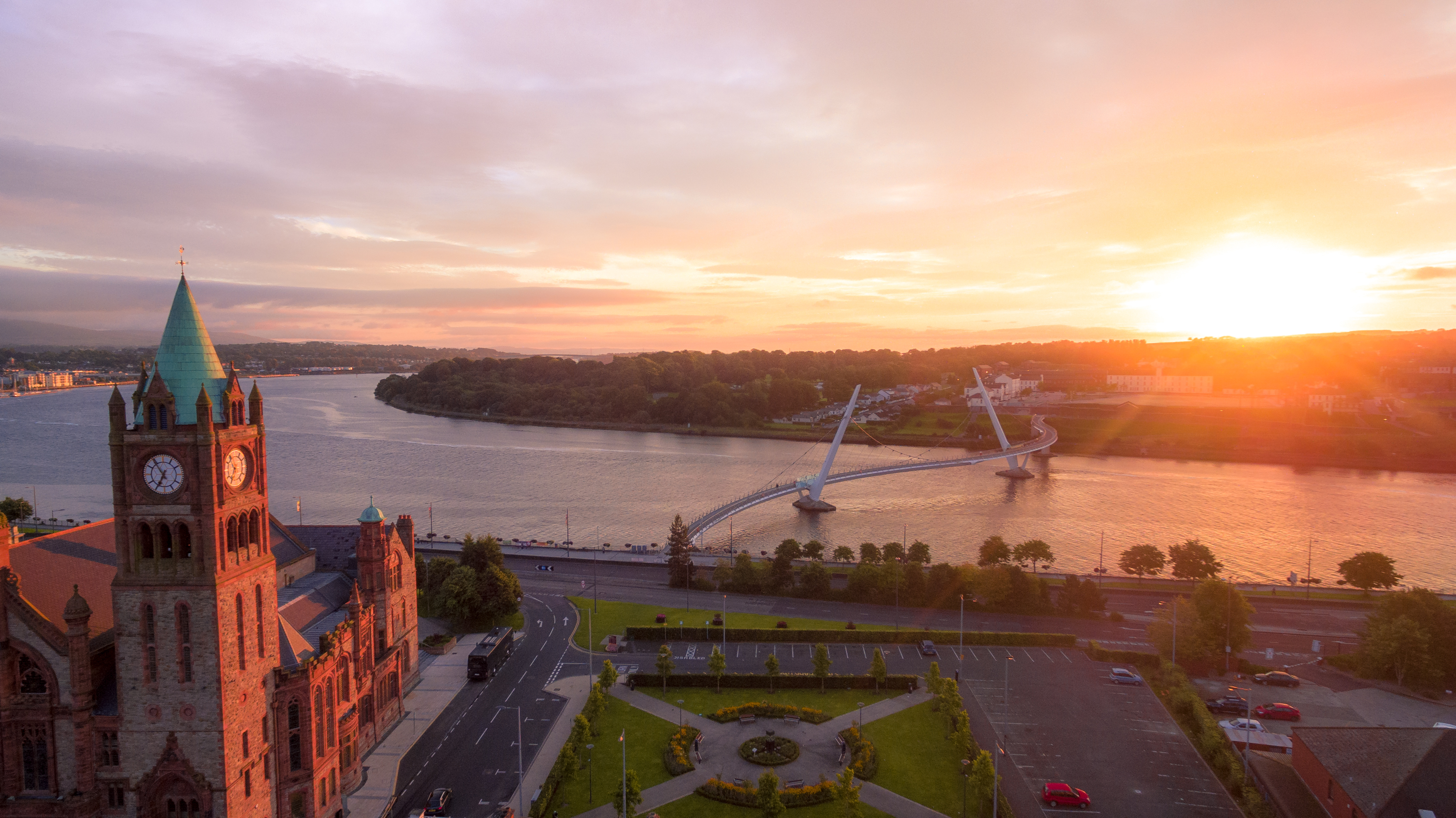 Sun rises over the city of Derry~Londonderry and it's iconic Peace Bridge