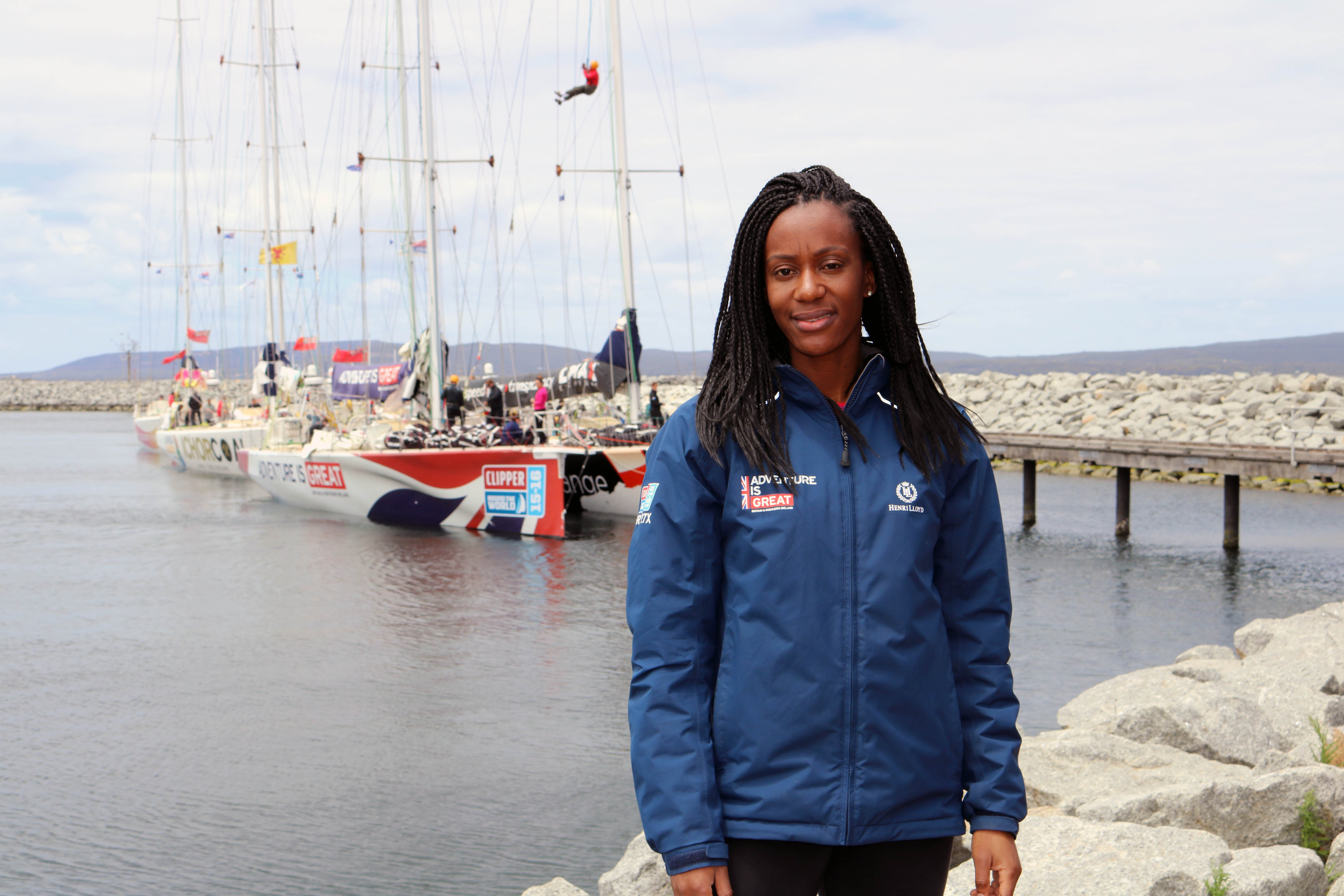 Abi Oyepitan in front of the GREAT Britain boat 