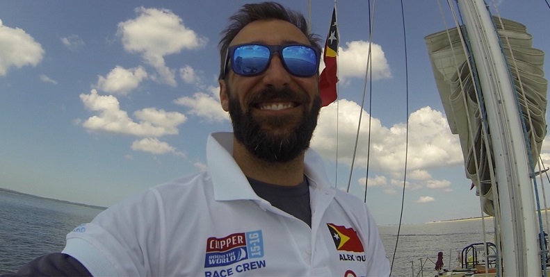 Crew member Alex Couto pictured on desk during Clipper Race training 