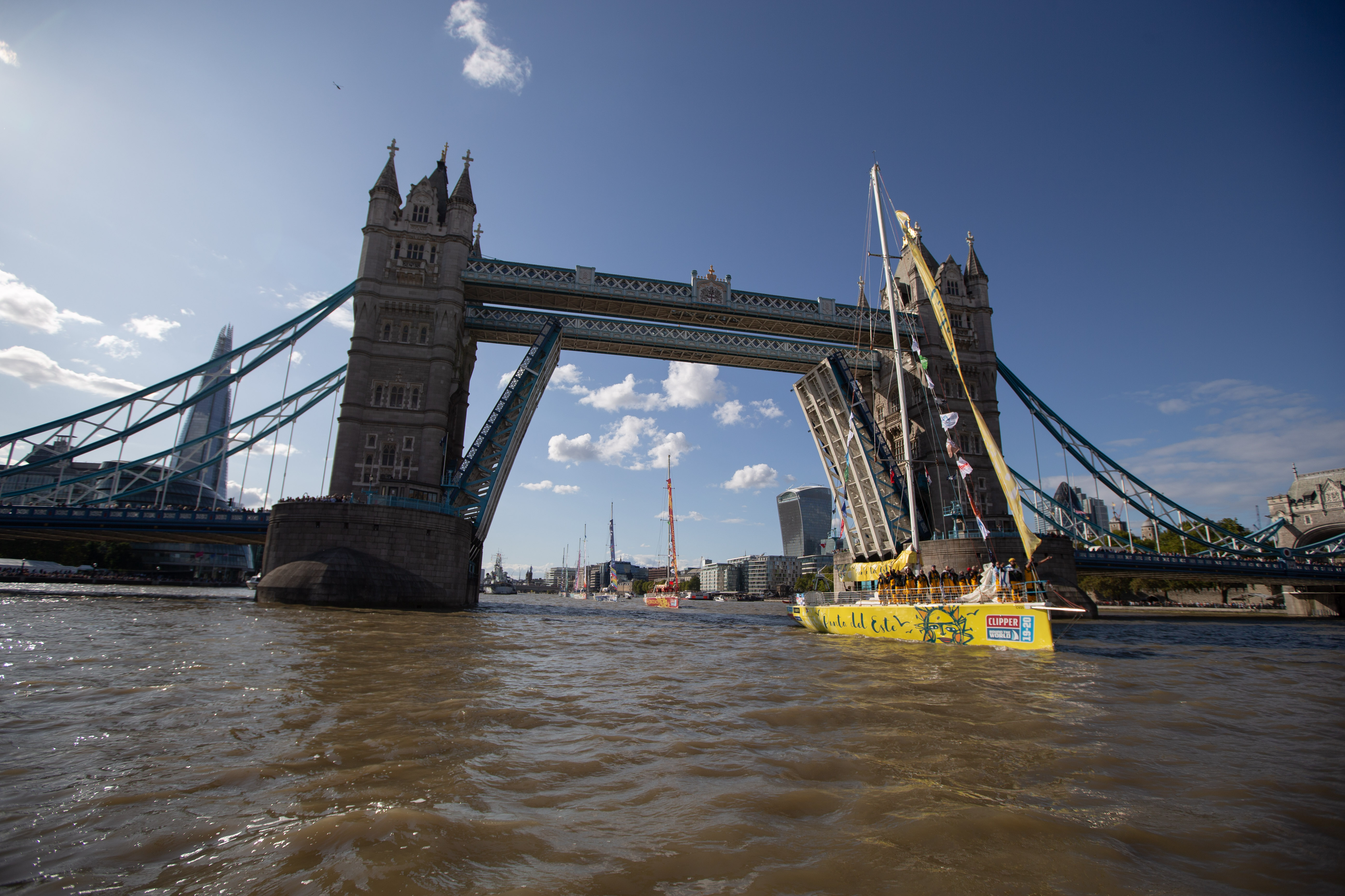 Clipper Race fleet passes under Tower Bridge