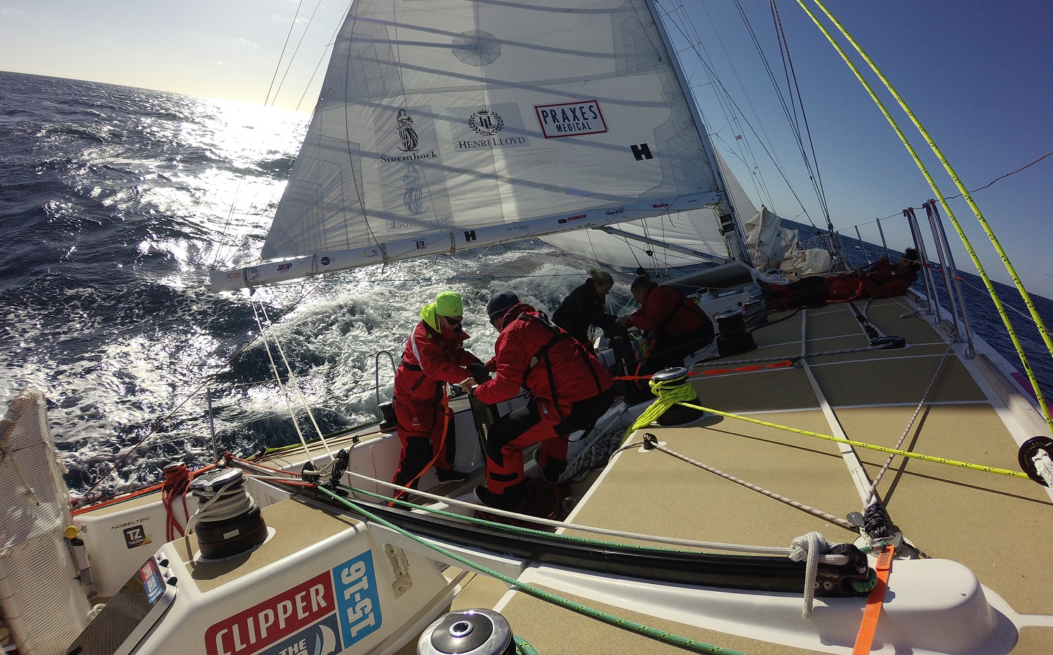 Crew shown grinding sails on board during Race 11 
