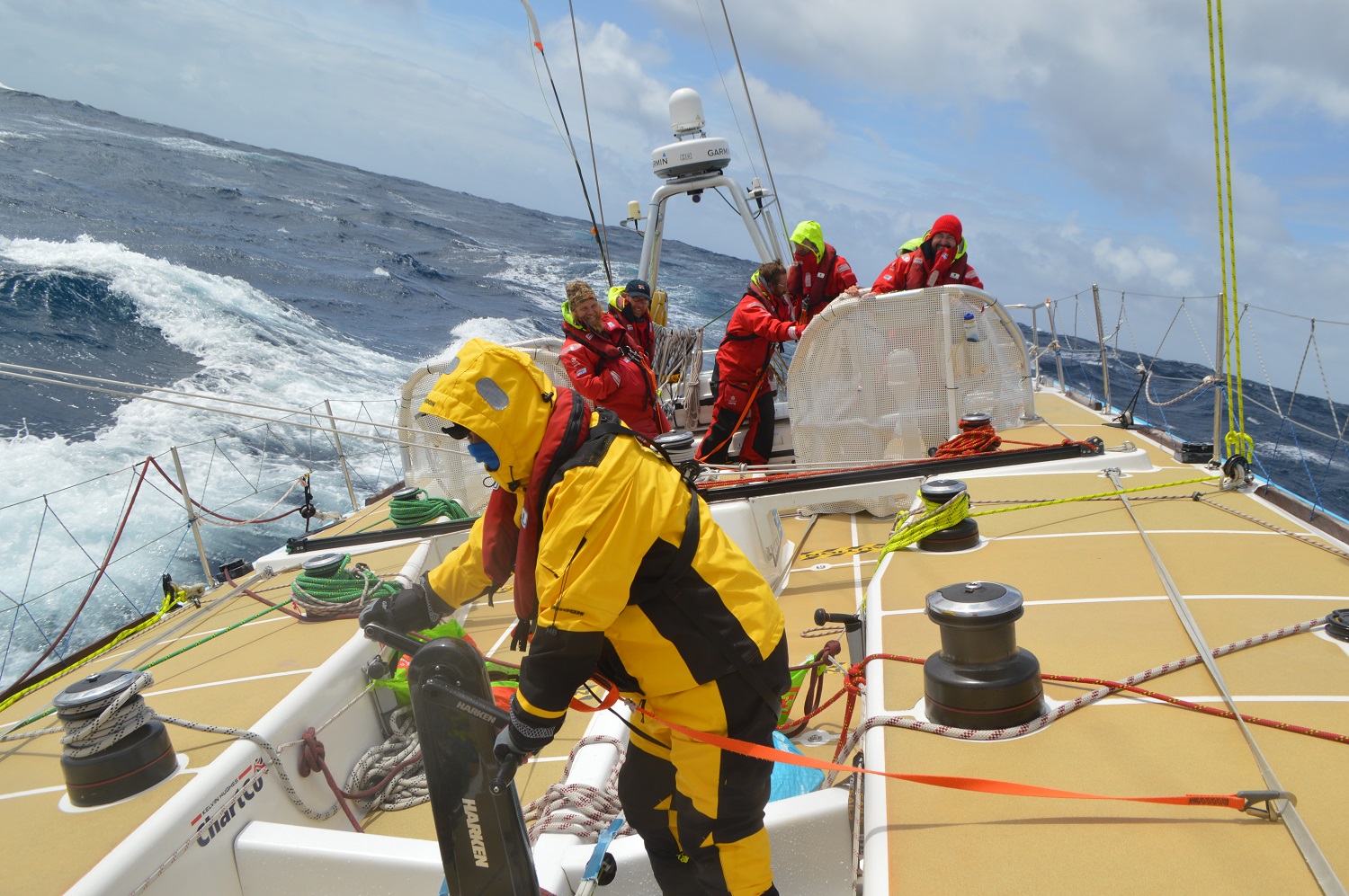 The crew of Unicef pictured working hard on board in mid Atlantic Ocean 