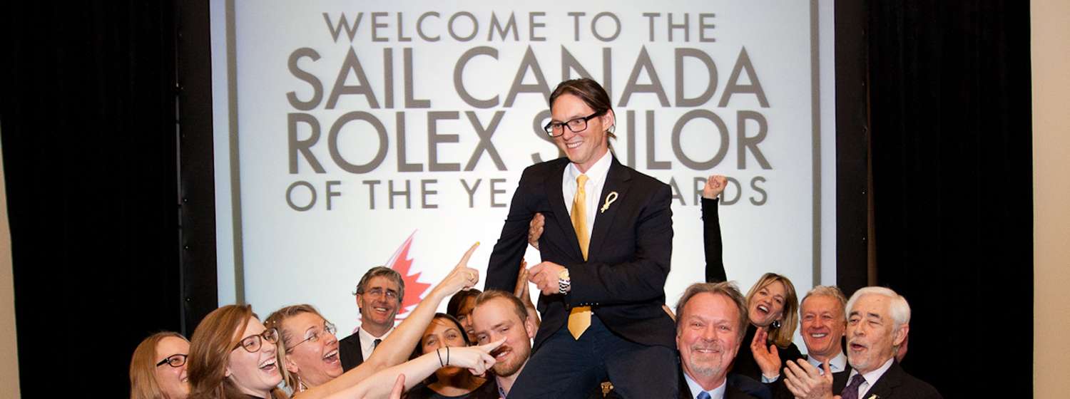 Eric Holden shown celebrating with former crew mates at the Sail Canada Awards 