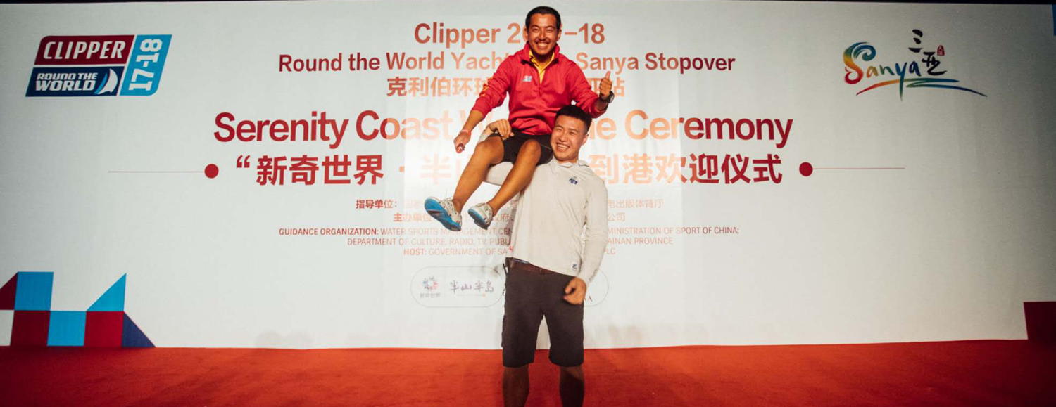 Fan on stage with Qingdao Ambassador, Hungry, during the recent Sanya Stopover