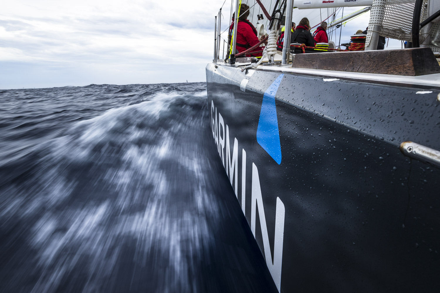 The hull of the Garmin boat shown whipping through the water 
