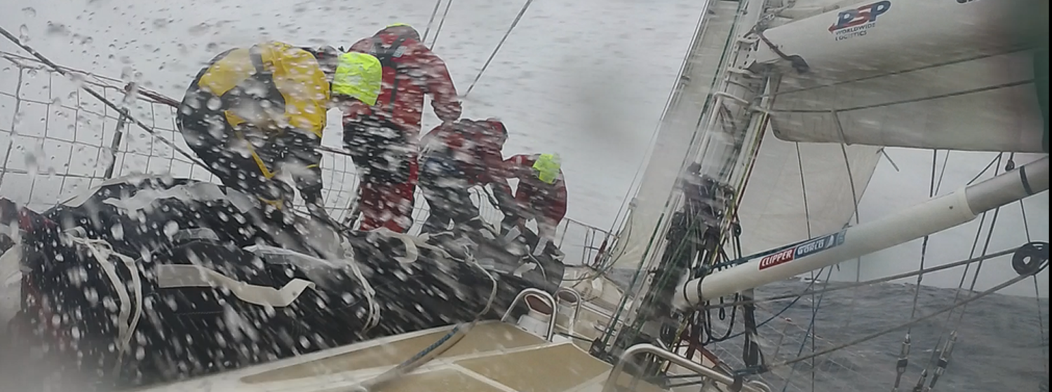 Liverpool 2018 crew take a sail bag up the bow in squally conditions