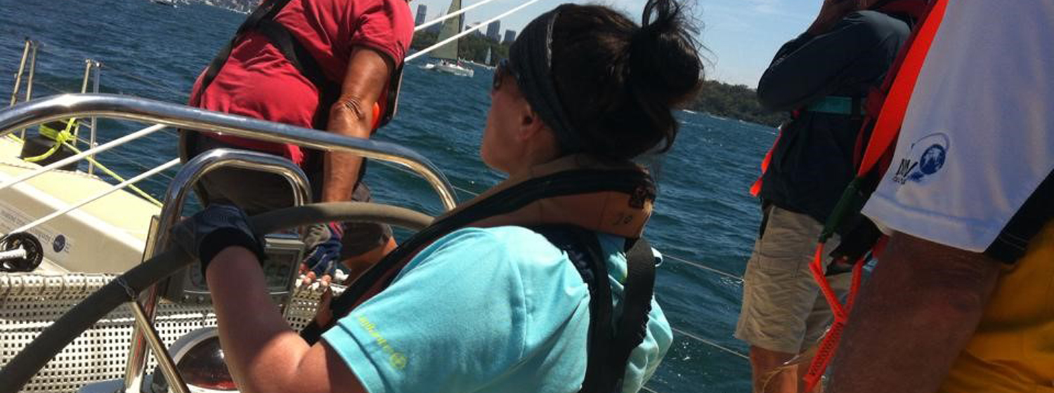 Nicola Edwards behind the helm in Sydney on her Clipper Race training