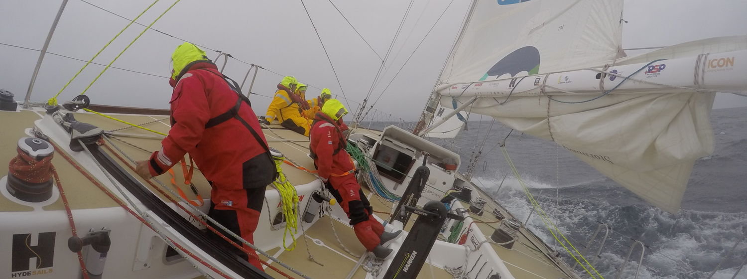 Crew shown racing on board at 30 degree angle