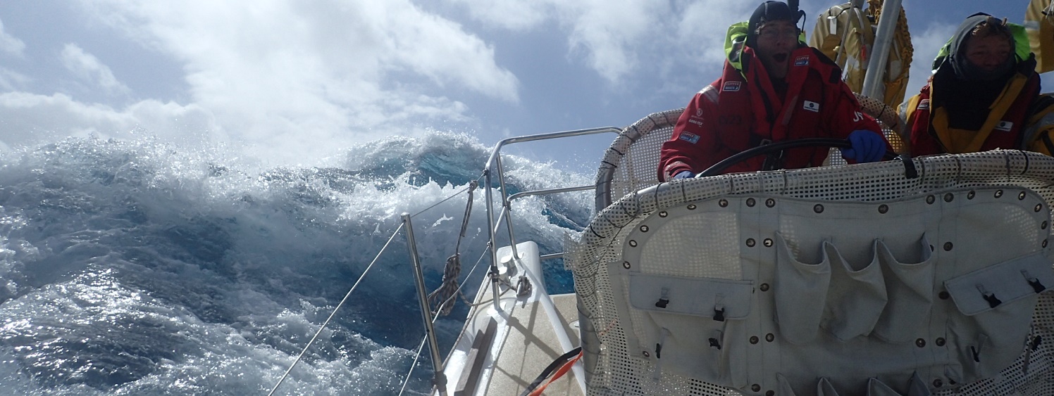 Crew member John Mccafrey on Visit Seattle helming in huge waves 