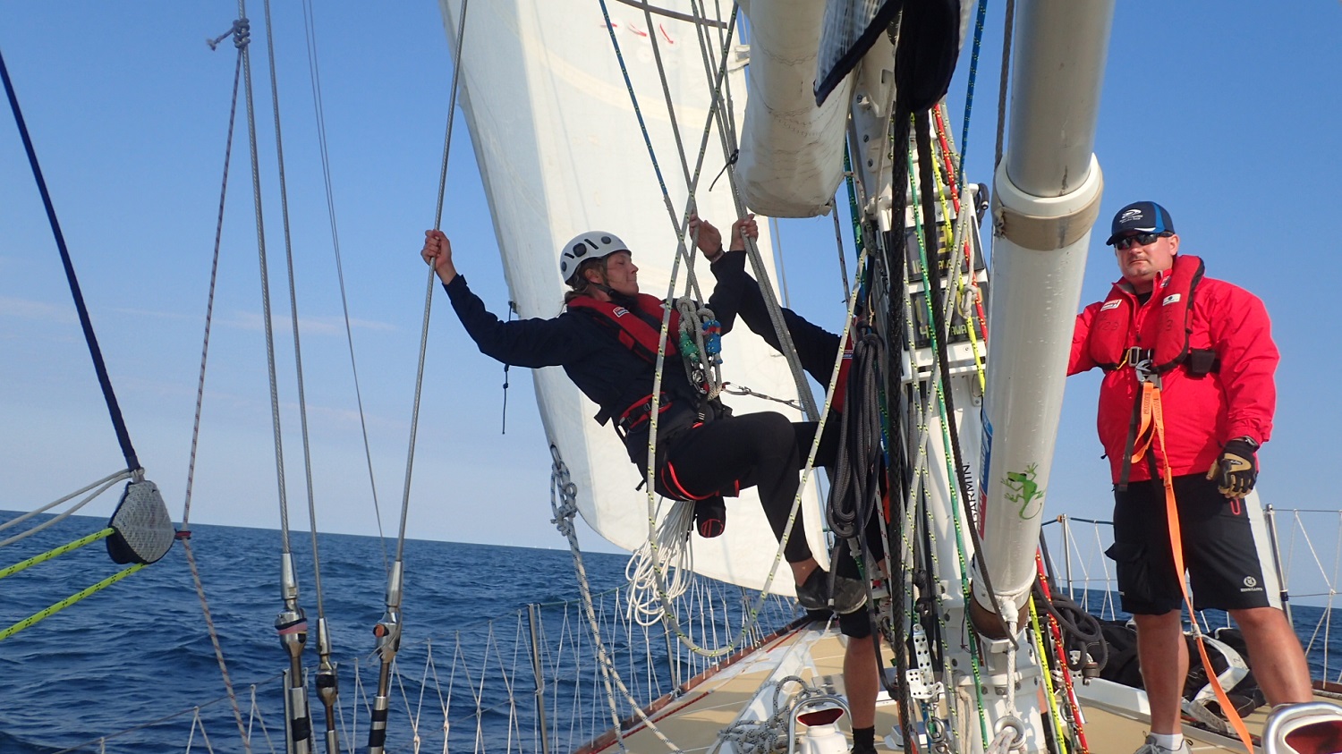 Crew member seen preparing to climb mast 