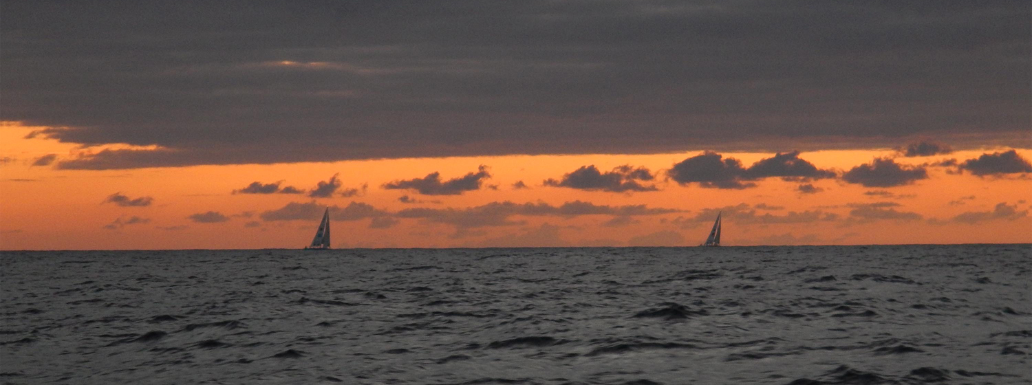 yachts on the horizon at sunrise