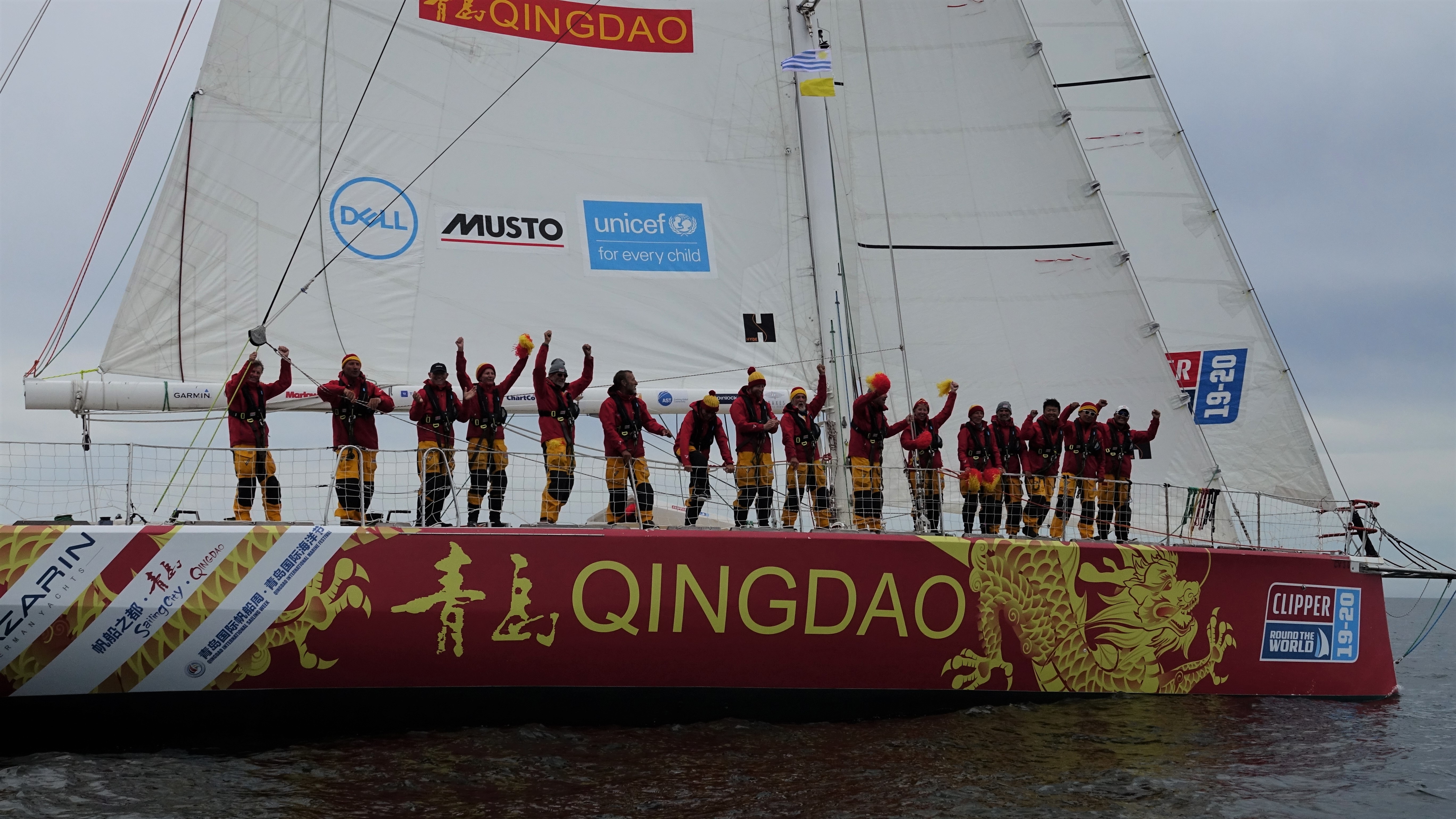 The crew of Qingdao celebrate winning first place into Punta del Este