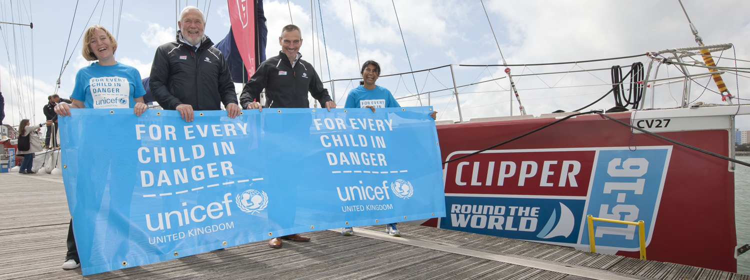 Sir Robin and William Ward pictured with Unicef team and banner 