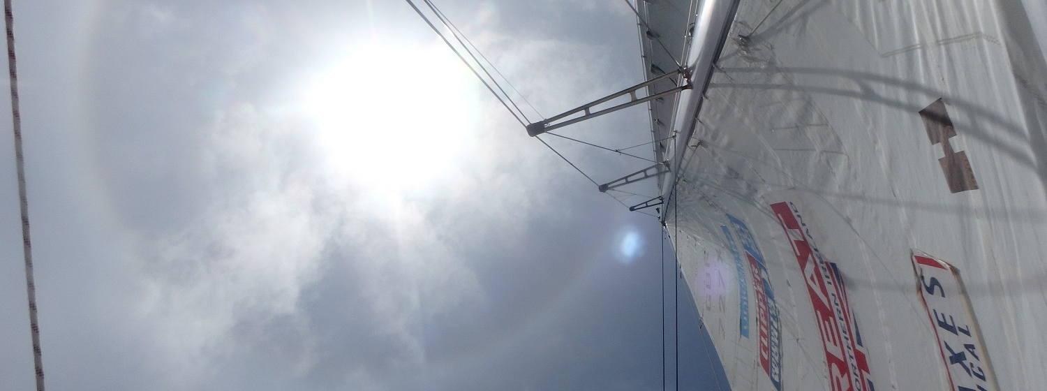 The sun shown shining strongly, looking upwards from GREAT Britain’s mainsail