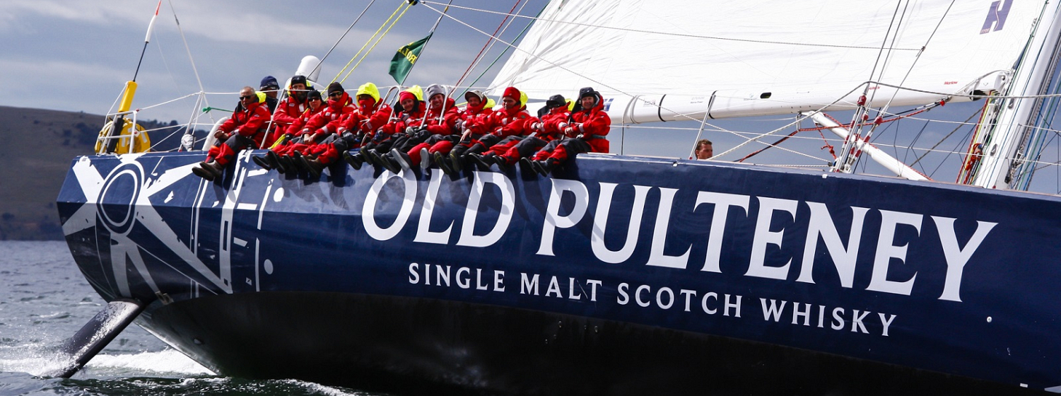 The Old Pulteney team shown celebrating with a whisky tasting session during the race