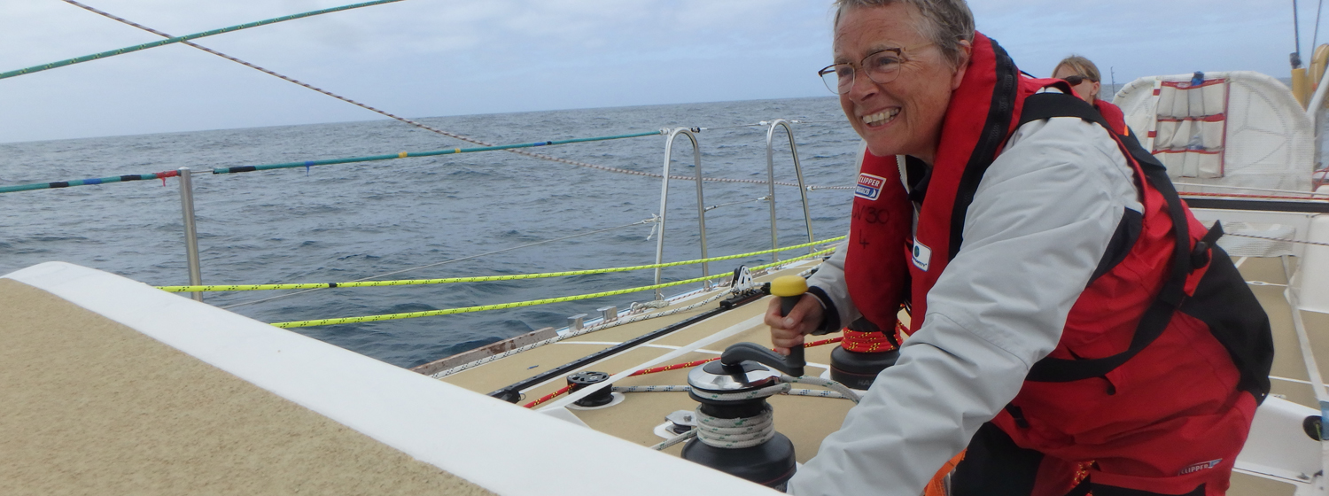 Crew member Kate Whyatt shown trimming sails in light winds on board Unicef