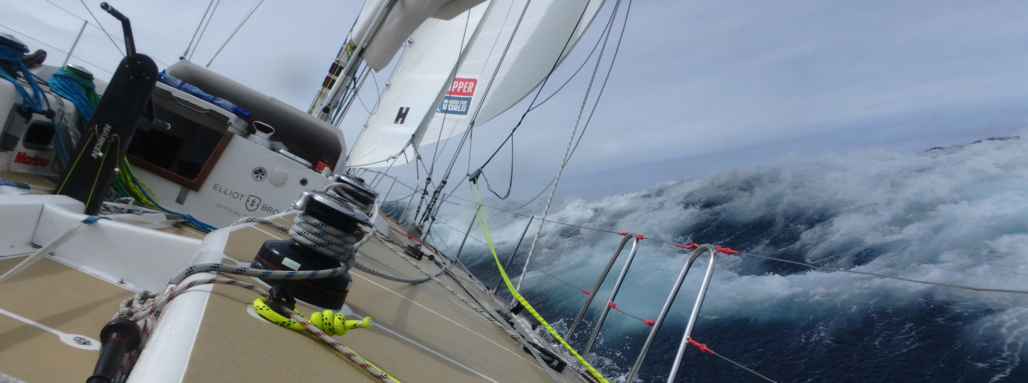 On board view of a Clipper yacht racing at 40 degrees through waves 