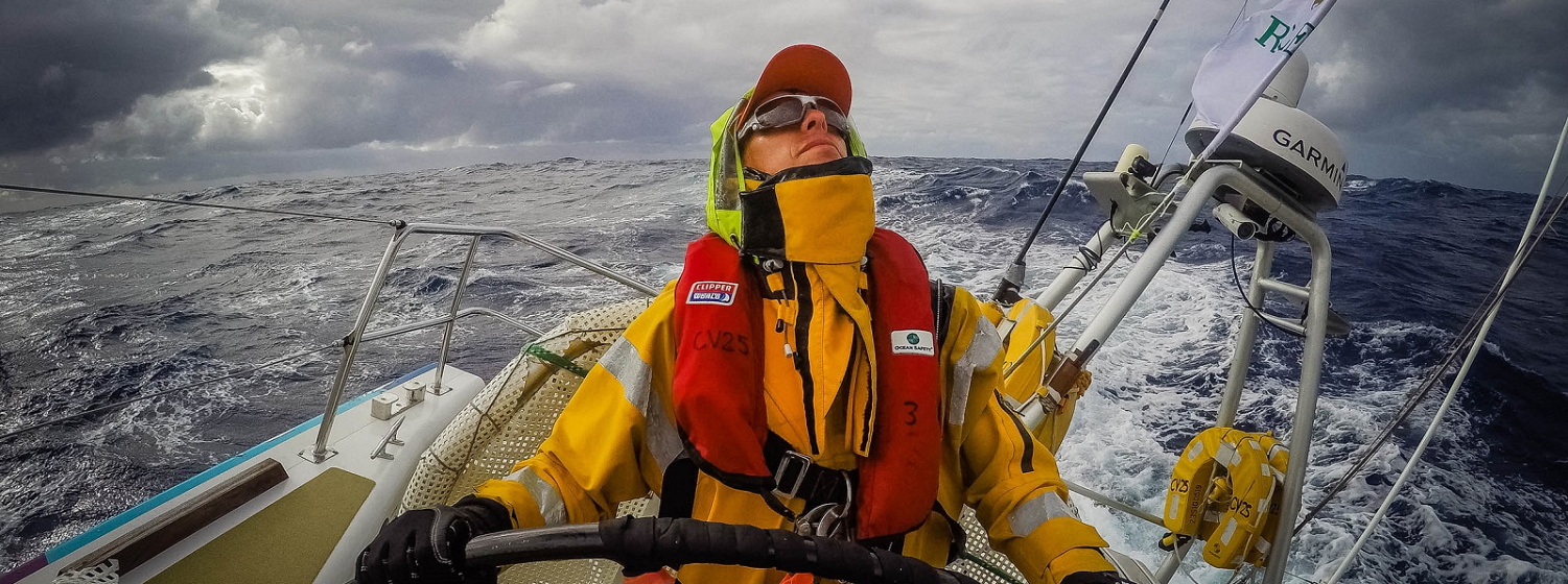 Crew member Mark Hundleby checks the wind direction